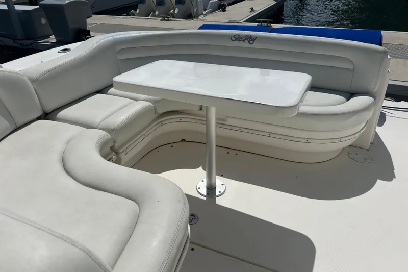 Slide: The Image of Luxurious seating area on a 2008 Sea Ray 340 Sundancer yacht with a white table. - 19