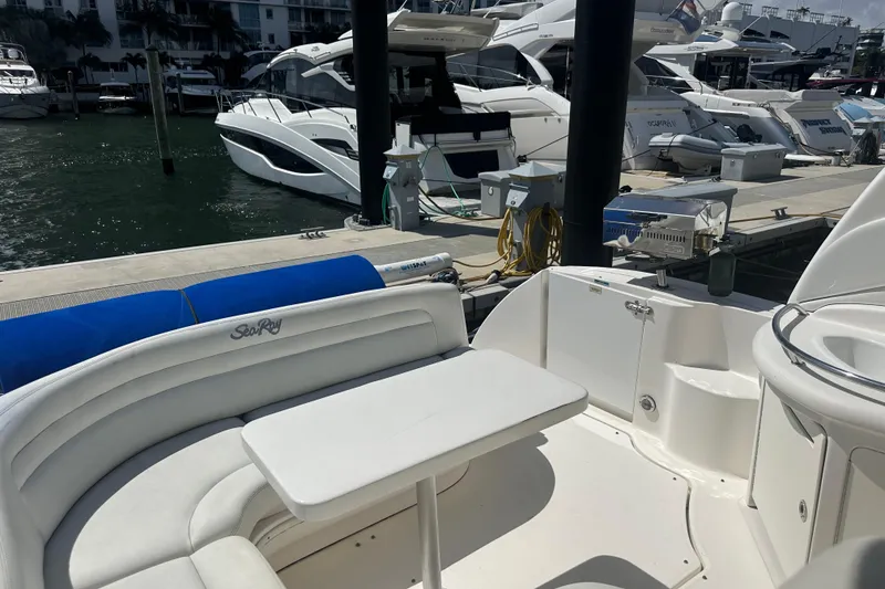 Slide: The Image of 2008 Sea Ray 340 Sundancer yacht interior with seating and table at marina. - 21