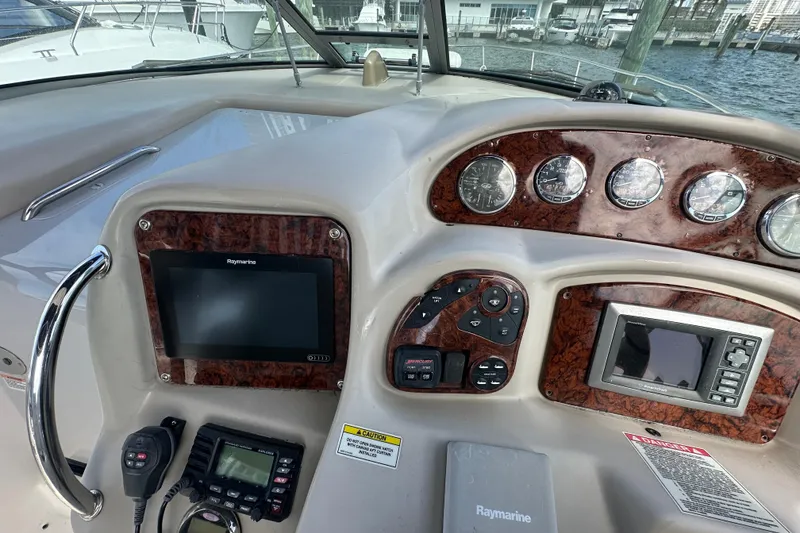 Slide: The Image of 2008 Sea Ray 340 Sundancer dashboard with navigation and control instruments. - 36