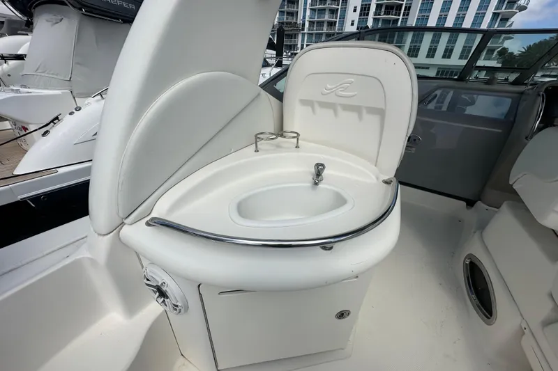 Slide: The Image of 2008 Sea Ray 340 Sundancer boat interior with compact sink and cup holders. - 47