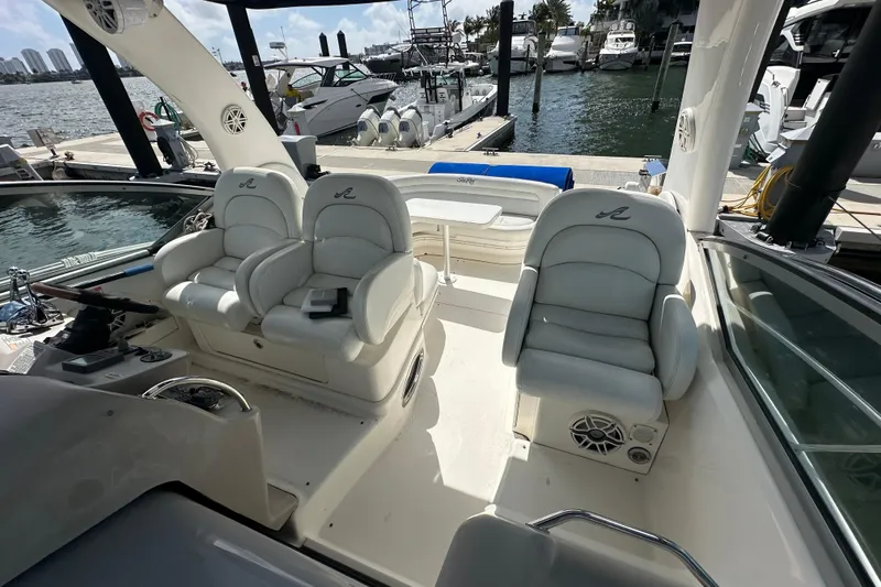 Slide: The Image of Interior of 2008 Sea Ray 340 Sundancer boat with white seating and marina view. - 51