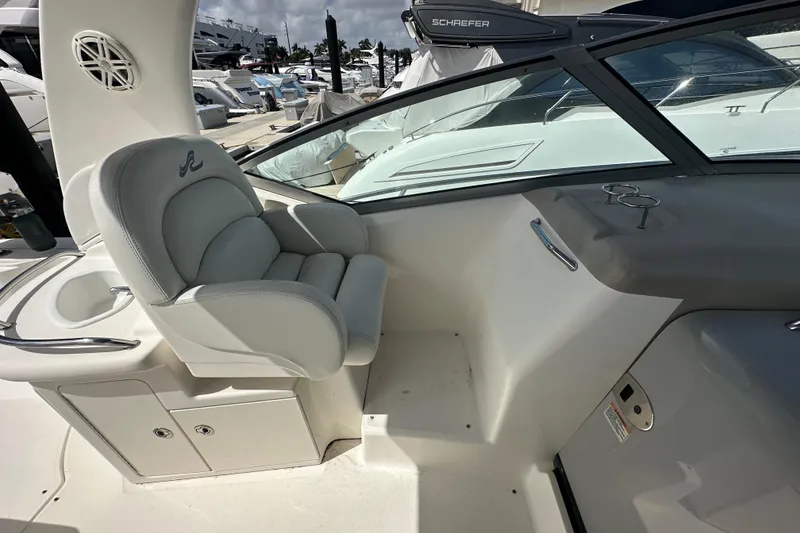 Slide: The Image of 2008 Sea Ray 340 Sundancer helm with luxurious seating and modern dashboard. - 52