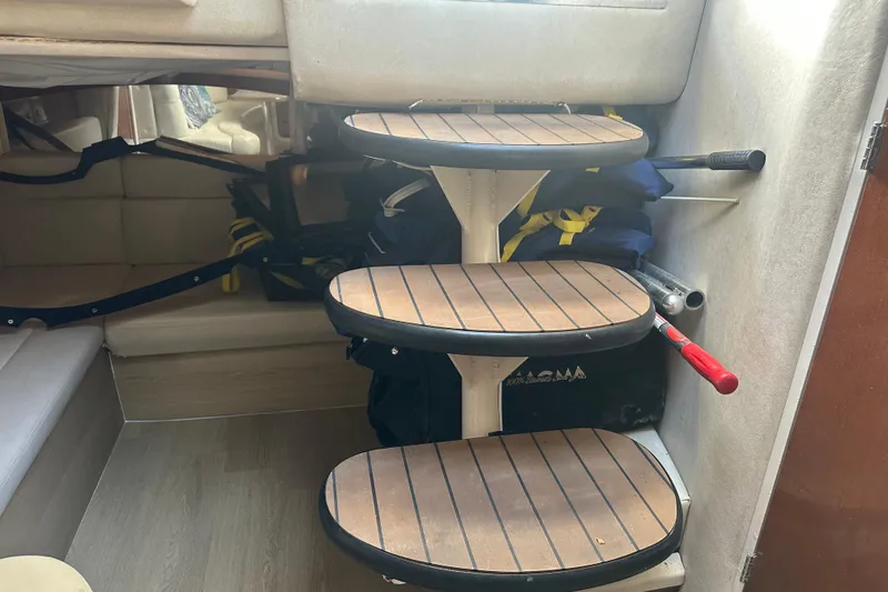 Slide: The Image of Interior of 2008 Sea Ray 340 Sundancer with wooden steps and storage area. - 54