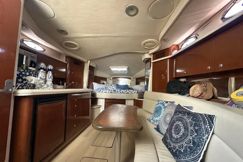 Slide: The Image of Luxurious interior of 2008 Sea Ray 340 Sundancer yacht with elegant wood finishes and cozy seating. - 58