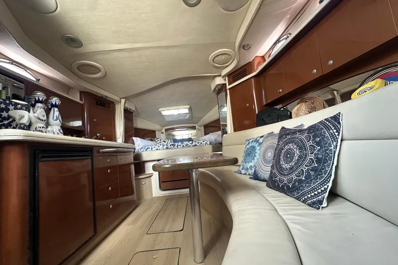 Slide: The Image of Luxurious interior of 2008 Sea Ray 340 Sundancer with elegant seating and decorative pillows. - 66