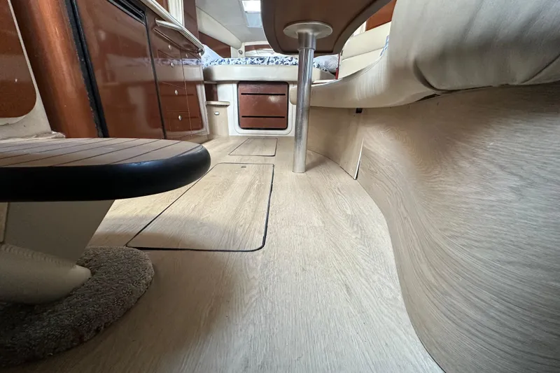 Slide: The Image of Interior view of 2008 Sea Ray 340 Sundancer, featuring wood flooring and seating area. - 68