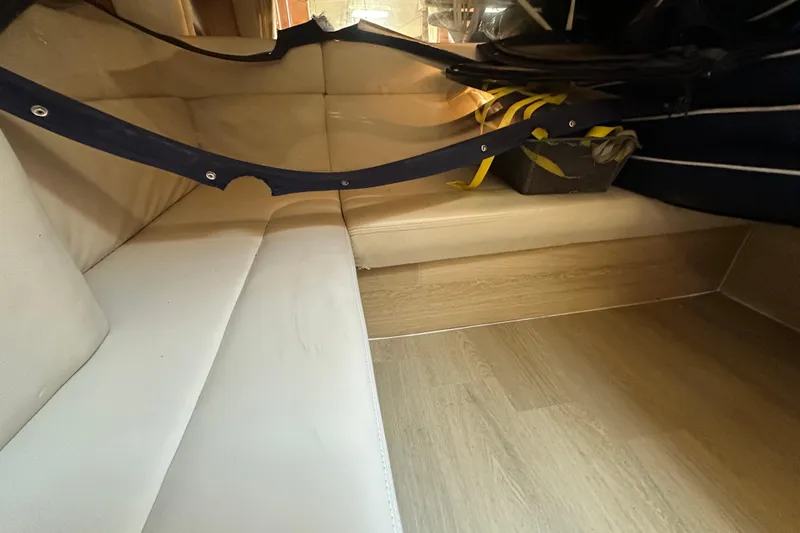 Slide: The Image of Interior of 2008 Sea Ray 340 Sundancer with beige seating and wooden flooring. - 69