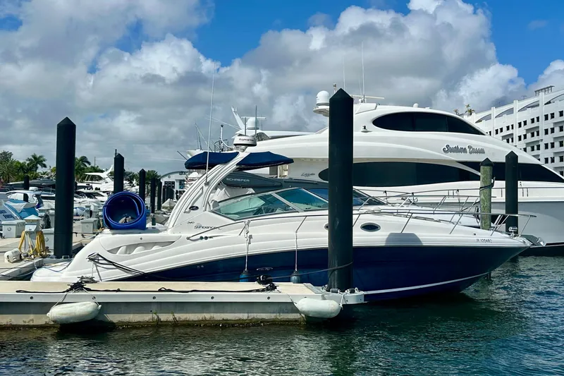 Slide: The Image of 2008 Sea Ray 340 Sundancer docked at marina under blue sky. - 7