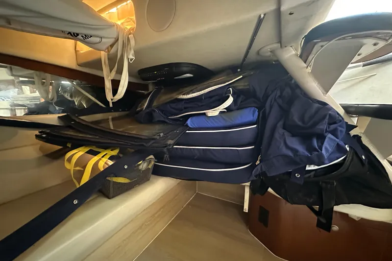 Slide: The Image of Interior storage area of a 2008 Sea Ray 340 Sundancer boat with cushions and gear. - 72