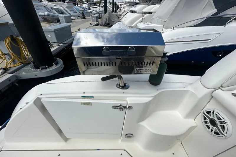 Slide: The Image of 2008 Sea Ray 340 Sundancer with a Magma grill on deck, docked at marina. - 78