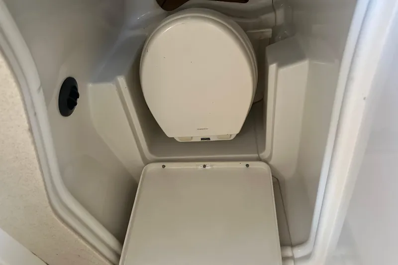 Slide: The Image of 2008 Sea Ray 340 Sundancer boat toilet interior, compact and functional design. - 79