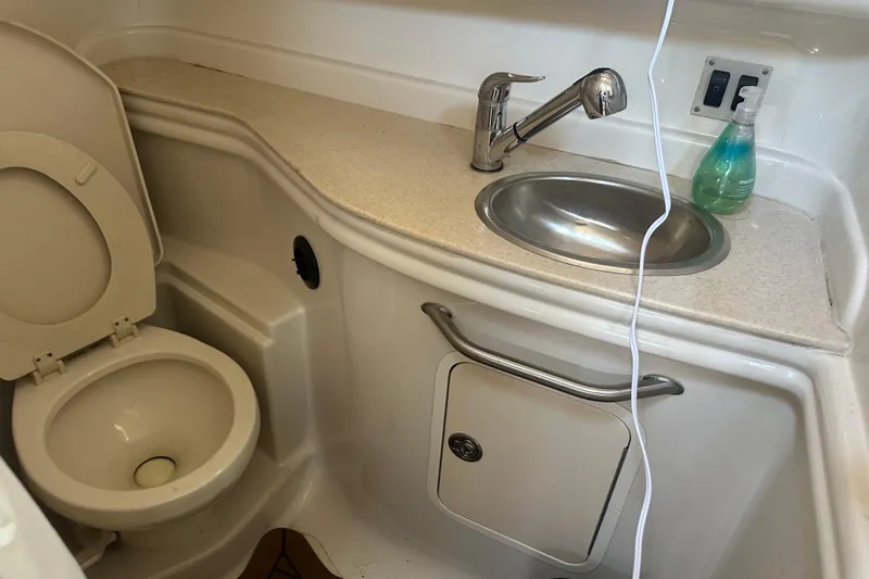 Slide: The Image of Bathroom interior of 2008 Sea Ray 340 Sundancer with sink and toilet. - 81
