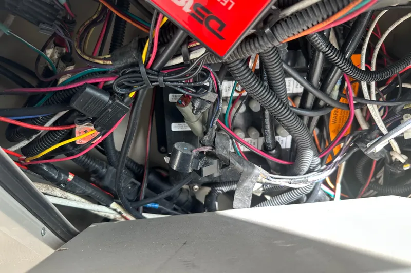 Slide: The Image of Electrical wiring inside a 2008 Sea Ray 340 Sundancer boat, showcasing complex cable arrangement. - 83