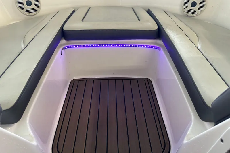 Slide: The Image of 2020 Yamaha AR190 boat interior with cushioned seating and LED lighting. - 7