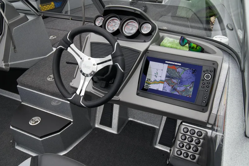 Slide: The Image of Manufacturer Provided Image: 2026 Ranger 1880MS boat dashboard with steering wheel and navigation display. - 32