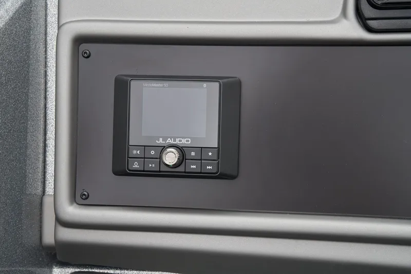 Slide: The Image of Manufacturer Provided Image: Control panel of 2026 Ranger 1880MS boat featuring JL Audio system. - 49
