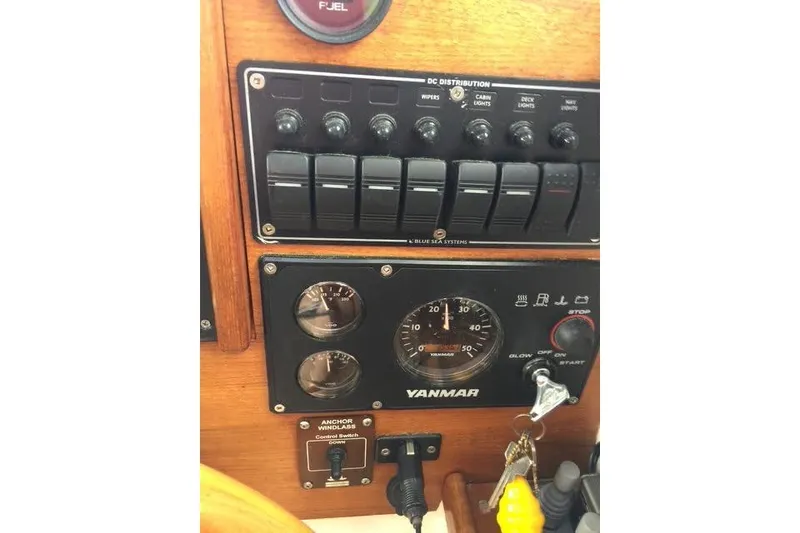 Slide: The Image of 2007 Ranger Tugs R-25 SC dashboard with Yanmar controls and switches. - 26