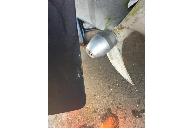 Slide: The Image of Close-up of a 2007 Ranger Tugs R-25 SC boat propeller with visible wear. - 39