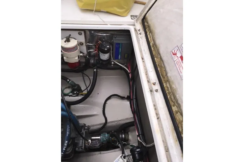 Slide: The Image of Engine compartment of 2007 Ranger Tugs R-25 SC boat, showing mechanical components and wiring. - 42