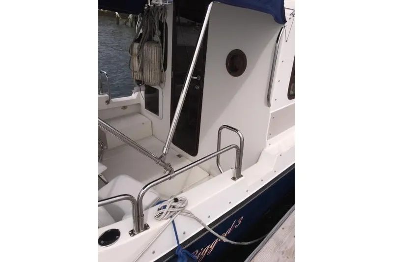 Slide: The Image of 2007 Ranger Tugs R-25 SC boat deck with railing and mooring lines. - 7