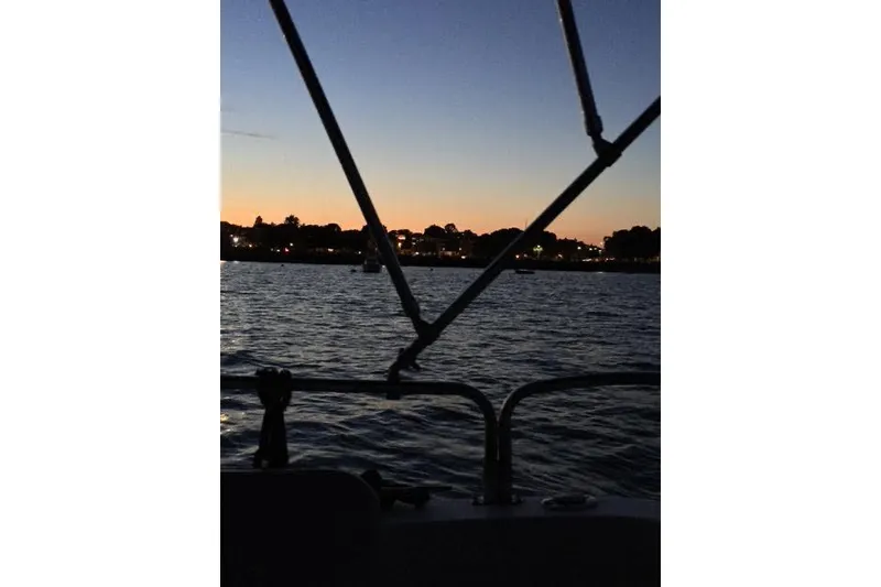 Slide: The Image of Sunset view from a 2007 Ranger Tugs R-25 SC boat on the water. - 19