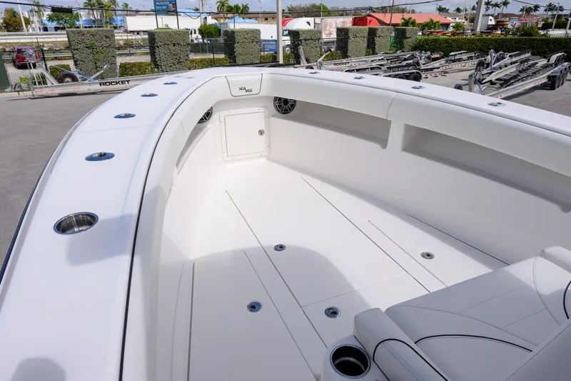 Slide: The Image of 2025 SeaVee 290B boat interior with sleek white seating and stainless steel fixtures. - 11