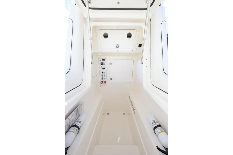 Slide: The Image of Interior view of 2025 SeaVee 290B boat, featuring control panel and safety equipment. - 12