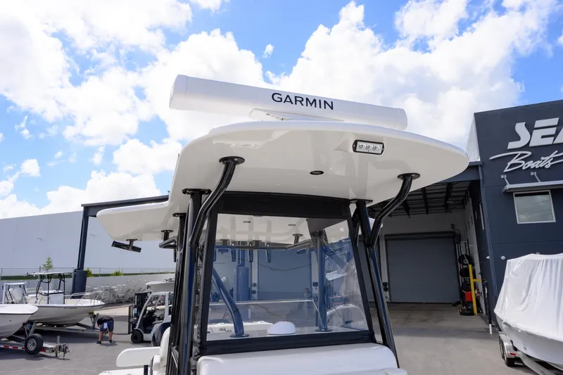 Slide: The Image of 2025 SeaVee 290B boat with Garmin equipment, displayed at SeaVee Boats facility. - 14