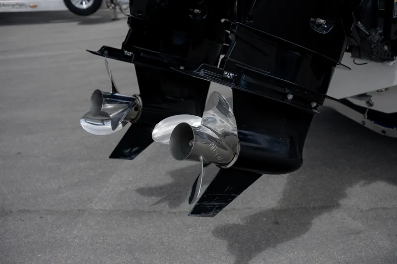 Slide: The Image of Twin propellers on a 2025 SeaVee 290B boat, parked on pavement. - 4