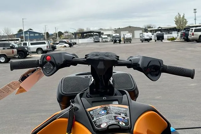 Slide: The Image of Handlebars of a 2026 Sea-Doo SPARK TRIXX on a parking lot. - 13