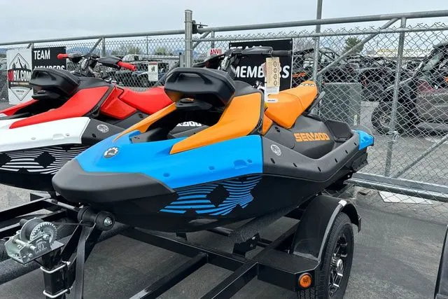 Slide: The Image of 2026 Sea-Doo PWC SPARK TRIXX 90 in blue and orange on trailer. - 19