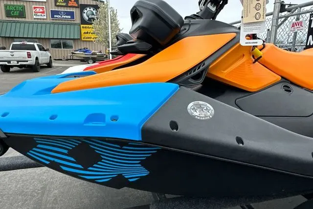 Slide: The Image of 2026 Sea-Doo PWC SPARK TRIXX 90 in vibrant colors on a parking lot. - 8