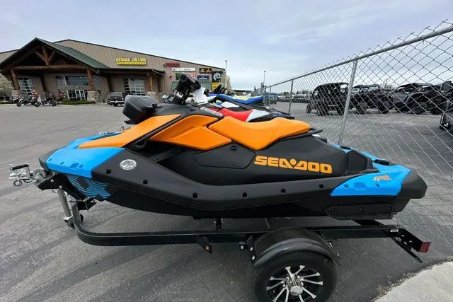 The Image of 2026 Sea-Doo PWC SPARK TRIXX 90 on trailer, blue-orange. - 1