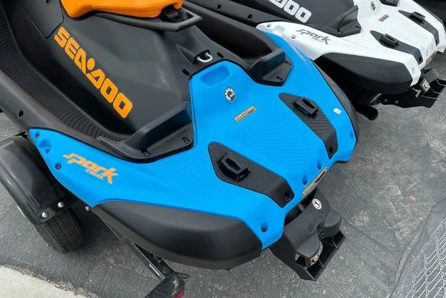 Slide: The Image of 2026 Sea-Doo SPARK TRIXX 90 in blue and black on a trailer. - 12