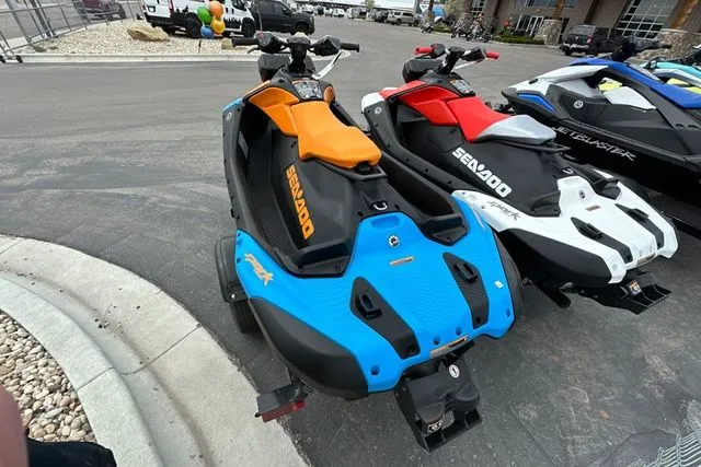 Slide: The Image of 2026 Sea-Doo PWC SPARK TRIXX 90 in blue and orange on parking lot. - 21