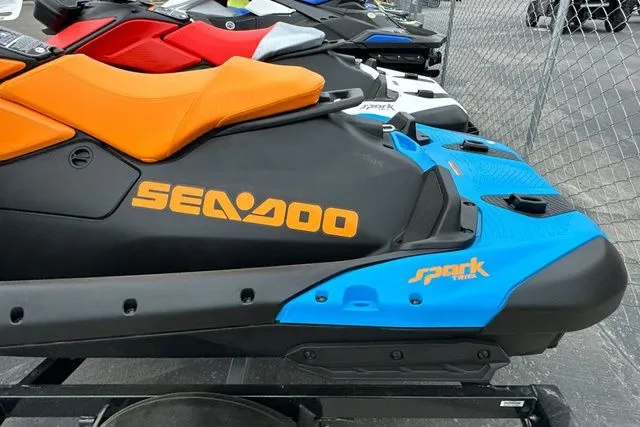 Slide: The Image of 2026 Sea-Doo PWC SPARK TRIXX 90, orange and blue, on a trailer. - 28