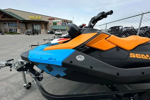 Slide: The Image of 2026 Sea-Doo PWC SPARK TRIXX 90 on trailer, orange and blue. - 8