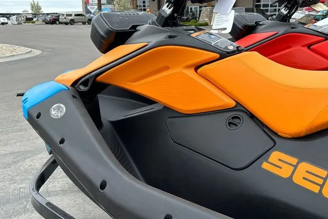 Slide: The Image of Sea-Doo PWC SPARK TRIXX 2026 with orange seat and black hull. - 9