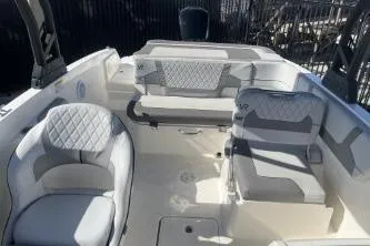 Slide: The Image of 2022 Bayliner VR6 Bowrider OB interior with cushioned seating and modern design. - 12