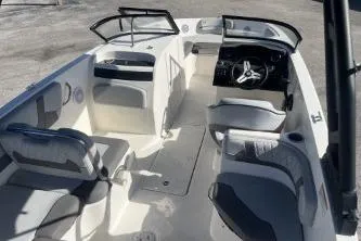 Slide: The Image of 2022 Bayliner VR6 Bowrider OB interior with seating and steering console. - 8