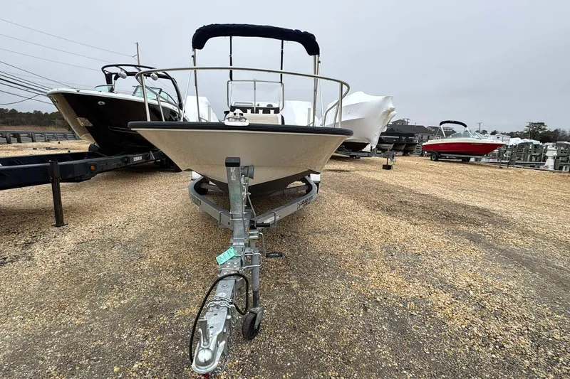 Slide: The Image of 2021 Boston Whaler 170 Montauk boat on trailer in a gravel lot. - 7