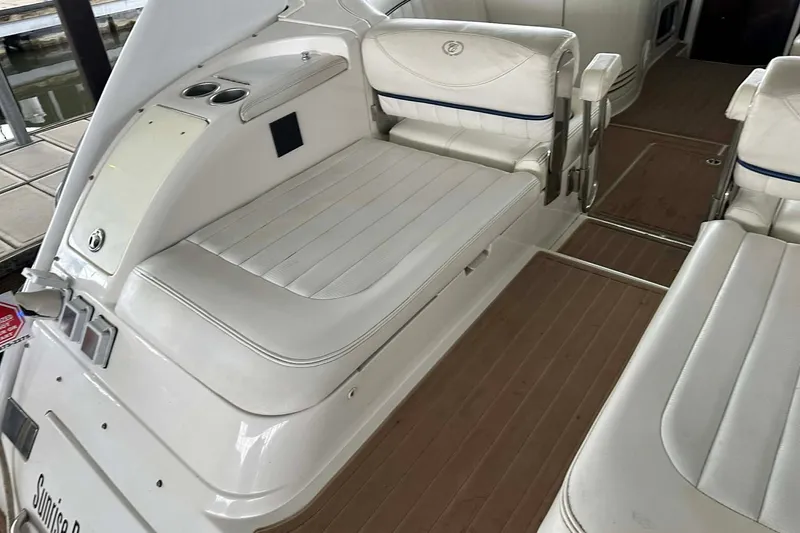 Slide: The Image of 2004 Cobalt 360 Cruiser interior with white leather seating and wood flooring. - 13