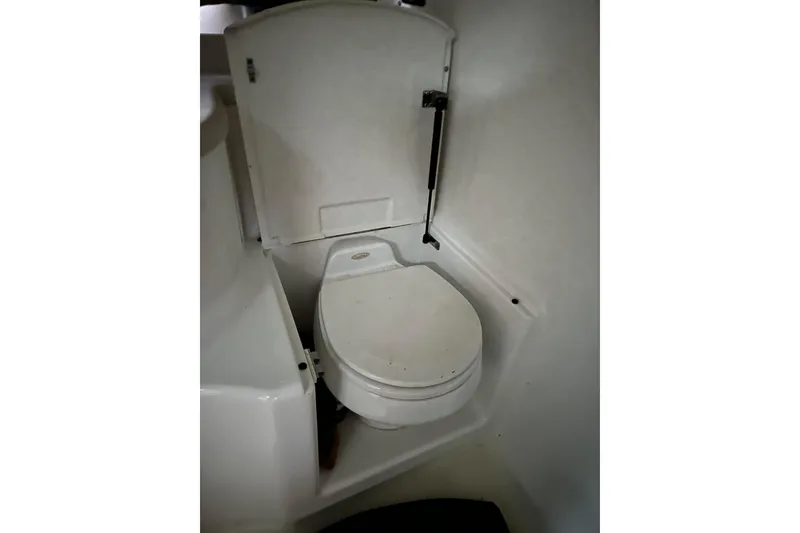 Slide: The Image of 2004 Cobalt 360 Cruiser bathroom with compact marine toilet. - 18
