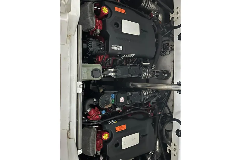 Slide: The Image of Engine compartment of a 2004 Cobalt 360 Cruiser, showcasing dual engines and components. - 19