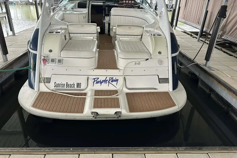 Slide: The Image of 2004 Cobalt 360 Cruiser docked at Sunrise Beach, MO, featuring spacious seating and elegant design. - 2