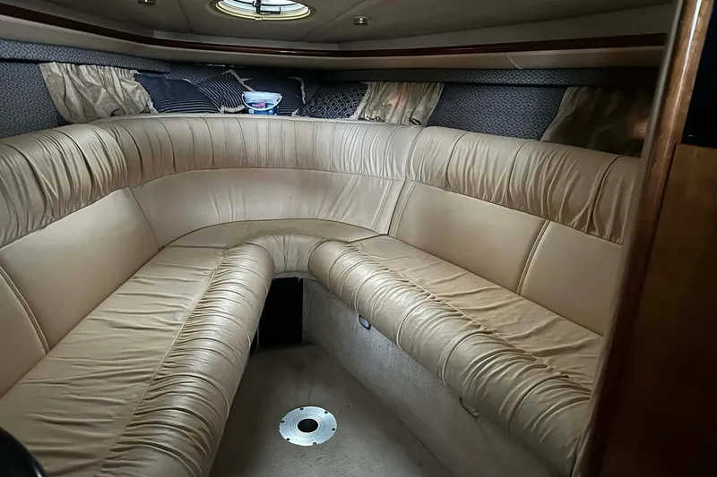 Slide: The Image of Interior of a 2004 Cobalt 360 Cruiser with beige leather seating. - 3