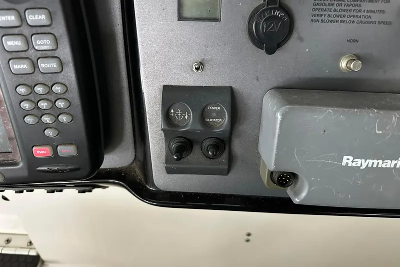 Slide: The Image of Control panel of a 2004 Cobalt 360 Cruiser with navigation and power switches. - 6