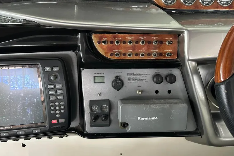 Slide: The Image of Control panel of a 2004 Cobalt 360 Cruiser with navigation and system controls. - 7