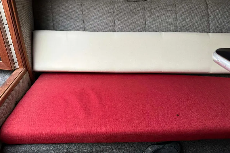 Slide: The Image of Red and white seating in 1987 IMP 255 Eleganza boat interior. - 16