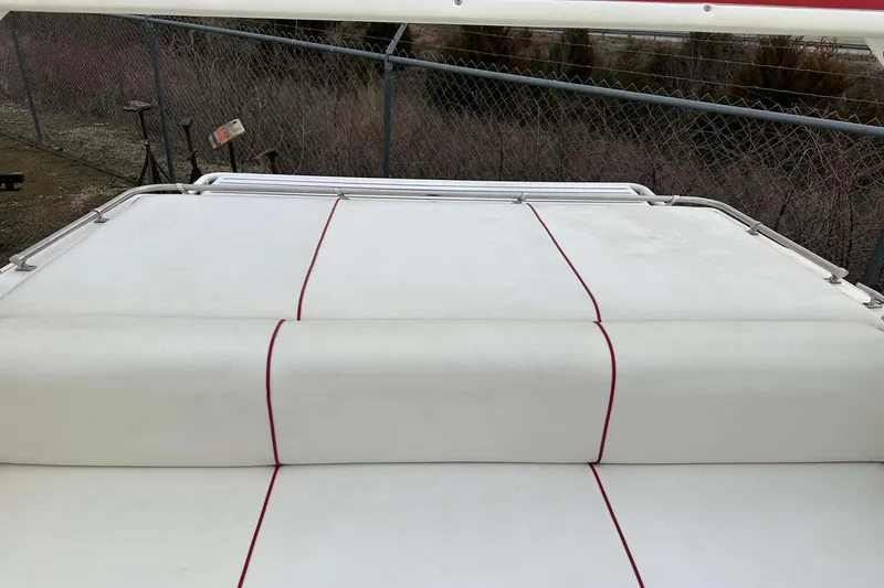 Slide: The Image of 1987 IMP 255 Eleganza boat with white and red-striped upholstery. - 17